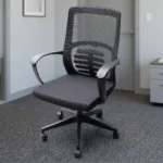 Ergonomic medium back office chair featuring a breathable black mesh backrest with an integrated skeletal lumbar support pattern, curved fixed black armrests, a cushioned black fabric seat, an under-seat height-adjustment lever, and a durable black five-star swivel base with smooth-rolling casters.