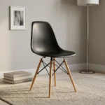 Black Eames-style dining chair featuring a molded matte black polypropylene shell seat, supported by natural wood dowel legs with black metal Eiffel-style wire bracing.