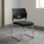 Stackable mesh visitor chair featuring a breathable black mesh backrest with a decorative geometric support accent, a armless design, a padded black fabric seat cushion, and a sleek chrome sled-base frStackable mesh visitor chair featuring a breathable black mesh backrest with a decorative geometric support accent, a armless design, a padded black fabric seat cushion, and a sleek chrome sled-base frame.ame.