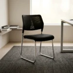 Stackable mesh visitor chair featuring a breathable black mesh backrest with a decorative geometric support accent, a armless design, a padded black fabric seat cushion, and a sleek chrome sled-base frame.