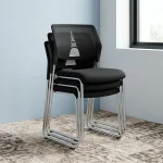 Mesh stackable waiting chair featuring a breathable black mesh backrest with a decorative geometric support accent, an armless space-saving design, a padded black fabric seat cushion, and a chrome-plated sled base shown in a stacked configuration.