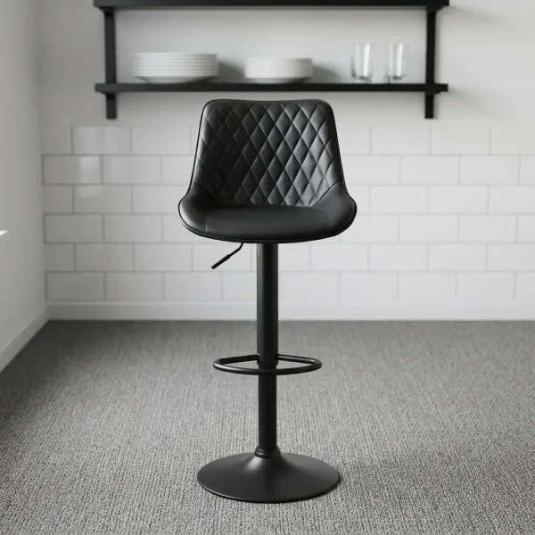 Black adjustable counter barstool featuring a diamond-tufted black faux leather bucket seat, a hydraulic gas-lift height adjustment lever, a circular metal footrest, and a matte black pedestal base with a swivel mechanism.