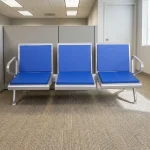 3-seater reception waiting bench featuring padded blue seat and back cushions, a durable silver metal frame with integrated side armrests, and a sturdy crossbar beam support with adjustable levelling feet.