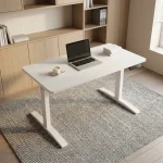 1.4m white electric standing desk featuring a smooth white rectangular tabletop, an under-desk digital LED control panel with memory presets, and a sturdy white powder-coated T-frame steel base.