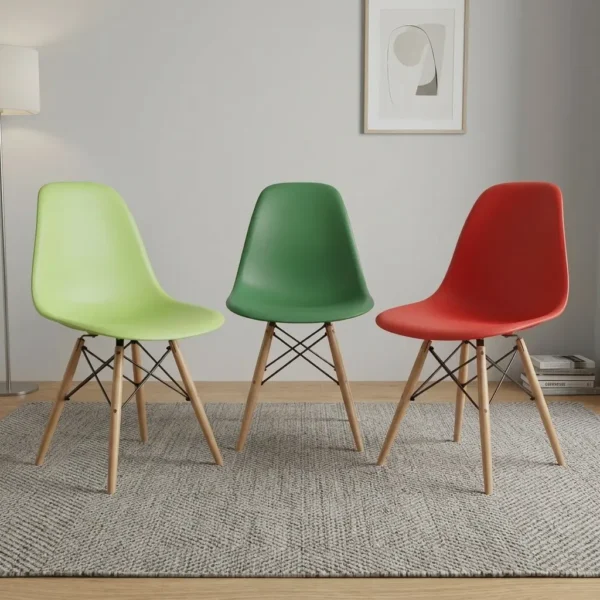 Plastic Eames dining chairs featuring molded polypropylene seat shells in lime green, forest green, and red, supported by natural wood dowel legs with black metal wire Eiffel bracing.