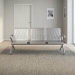 3-seater heavy-duty bench featuring perforated silver steel contoured seats and backrests, curved side armrests, and a durable steel beam support frame with adjustable blue-accented leveling feet.