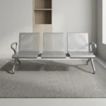 3-seater heavy-duty bench featuring perforated silver steel contoured seats and backrests, curved side armrests, and a durable steel beam support frame with adjustable blue-accented leveling feet.