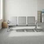 3-seater heavy-duty bench featuring perforated silver steel contoured seats and backrests, curved side armrests, and a durable steel beam support frame with adjustable blue-accented leveling feet.