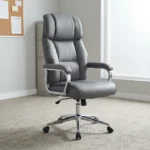 Director's gray executive office chair featuring a high-back design with plush segmented leatherette padding, padded armrests on chrome frames, pneumatically adjustable height controls, and a polished chrome five-star swivel base with caster wheels.