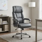 Director's gray executive office chair featuring a high-back design with plush segmented leatherette padding, padded armrests on chrome frames, pneumatically adjustable height controls, and a polished chrome five-star swivel base with caster wheels.