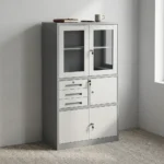 Lockable office cabinet with safe featuring a dual-tone charcoal grey and white powder-coated steel frame, upper framed glass-door display compartments, a middle section with three drawers alongside a lockable internal safe compartment, and lower double solid steel door lockable storage.