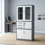 Lockable office cabinet with safe featuring a dual-tone charcoal grey and white powder-coated steel frame, upper framed glass-door display compartments, a middle section with three drawers alongside a lockable internal safe compartment, and lower double solid steel door lockable storage.