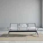 Non-padded steel waiting bench featuring a 3-seater design with perforated silver metallic seats and backrests, curved chrome armrests, a sturdy crossbar beam support, and angled chrome legs with non-marking foot glides.