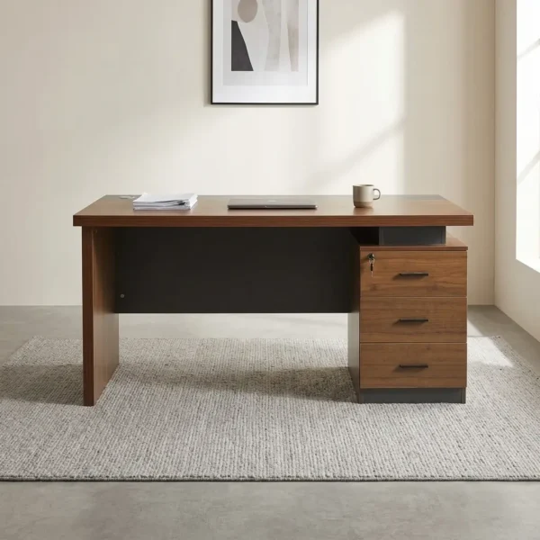 140cm executive office table featuring a warm walnut wood-grain desktop with a charcoal grey inlay strip, built-in cable grommet, dark grey modesty panel, solid panel side support, and an integrated three-drawer lockable side pedestal with slim black handles.
