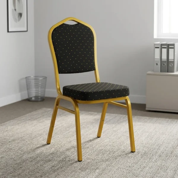 Black stackable conference chair featuring black fabric upholstery patterned with gold polka dots, a padded crown-back backrest and seat, and a durable gold-finished metal frame.