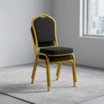 Black stackable conference chair featuring black fabric upholstery patterned with gold polka dots, a padded crown-back backrest and seat, and a durable gold-finished metal frame.