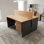 2-way wooden modular workstation featuring a face-to-face dual-person design, light natural oak tabletop finish, a central full-length wooden privacy divider panel, grey panel legs, integrated cable grommets on each desktop, and built-in 3-drawer lockable storage pedestals.