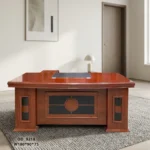 Executive 1800mm office table featuring a classic polished reddish-brown cherry wood finish, a gently curved front desktop with an embedded dark writing pad and cable grommets, decorative modesty paneling with dark inlay accents, and side pedestal bases.
