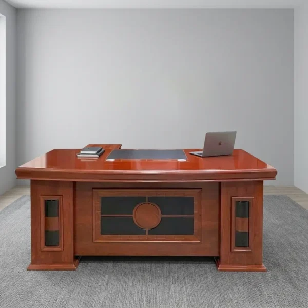 Executive 1800mm office table featuring a classic polished reddish-brown cherry wood finish, a gently curved front desktop with an embedded dark writing pad and cable grommets, decorative modesty paneling with dark inlay accents, and side pedestal bases.