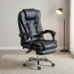 High-back ergonomic leather chair featuring plush black bonded leather upholstery with segmented horizontal padding, an integrated thick headrest, padded loop armrests, a retractable fold-out footrest under a double-padded seat cushion, and a polished chrome five-star base on smooth-rolling dual-wheel casters.