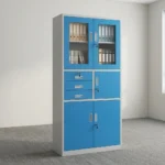 Blue office cabinet with safe featuring a steel construction with a white outer frame and vibrant blue doors/drawers, upper glass-panel double doors with key lock, a middle section with three stacked drawers on the left and a single lockable safe compartment on the right, and lower solid metal double doors with key lock.