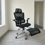 Recliner orthopedic chair with footrest featuring a breathable full-black mesh construction, an adjustable mesh headrest, a multi-segmented high backrest with specialized lower lumbar support, 3D adjustable armrests, a retractable mesh footrest, and a polished metallic five-star base on smooth-rolling casters.