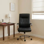 Black leather mid-back office chair featuring diamond-pattern tufted stitching, padded chrome armrests, and a polished metal 5-star swivel base.