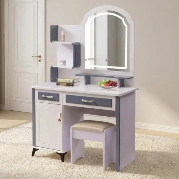 White dressing table with LED mirror featuring a stylish two-tone white and slate gray frame, an arched mirror with a illuminated touch-sensor LED surround, open multi-tier display shelves, two pull-out storage drawers, a lower storage cabinet with framed door detailing, and a matching cushioned vanity stool.