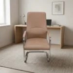 Brown executive waiting chair featuring smooth tan-brown leather upholstery with a high backrest, subtle lumbar stitching details, matching padded armrests on chrome frames, and a sleek cantilever chrome sled base.