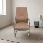 Brown executive waiting chair featuring smooth tan-brown leather upholstery with a high backrest, subtle lumbar stitching details, matching padded armrests on chrome frames, and a sleek cantilever chrome sled base.