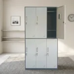 6-locker steel filing cabinet featuring a two-tier layout with light gray doors set in a dark gray metallic frame, individually lockable compartment doors equipped with recessed handles, key locks, card/label holders, ventilation louvers, and interior storage shelving with a hanging rod.