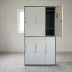 6-locker steel filing cabinet featuring a two-tier layout with light gray doors set in a dark gray metallic frame, individually lockable compartment doors equipped with recessed handles, key locks, card/label holders, ventilation louvers, and interior storage shelving with a hanging rod.