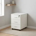 3-drawer mobile pedestal featuring a clean white finish, three stacked storage drawers with slim silver metal pull handles, a central key locking mechanism on the top drawer, and four smooth-rolling black caster wheels for easy mobility.