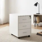 3-drawer mobile pedestal featuring a clean white finish, three stacked storage drawers with slim silver metal pull handles, a central key locking mechanism on the top drawer, and four smooth-rolling black caster wheels for easy mobility.