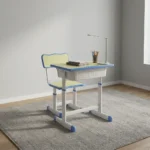 Adjustable kids study set featuring a pastel blue and light yellow ergonomic desk and chair, height-adjustable white metal frames, an integrated under-desk storage drawer, a side bag hook, and rounded safety edges on both the table and seat.