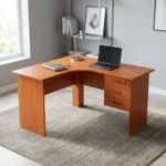 120cm curved office desk featuring a warm cherry wood finish, an ergonomic L-shaped corner desktop, full-length matching panel legs, a full-height modesty panel, and an integrated side pedestal with three lockable storage drawers fitted with black curved handles.