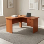 120cm curved office desk featuring a warm cherry wood finish, an ergonomic L-shaped corner desktop, full-length matching panel legs, a full-height modesty panel, and an integrated side pedestal with three lockable storage drawers fitted with black curved handles.