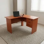 120cm curved office desk featuring a warm cherry wood finish, an ergonomic L-shaped corner desktop, full-length matching panel legs, a full-height modesty panel, and an integrated side pedestal with three lockable storage drawers fitted with black curved handles.