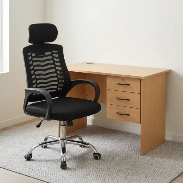 1m office desk & chair combo featuring a light oak wooden desk paired with an ergonomic black mesh high-back office chair. The desk includes a smooth rectangular surface with a cable grommet, side panel legs, a modesty panel, and an integrated right-side 3-drawer pedestal with black curved handles and a top lock. The chair features a breathable mesh backrest with structured lumbar pattern, an adjustable headrest, curved fixed armrests, a cushioned black seat, pneumatic height adjustment lever, and a polished chrome five-star base with dual-wheel casters.