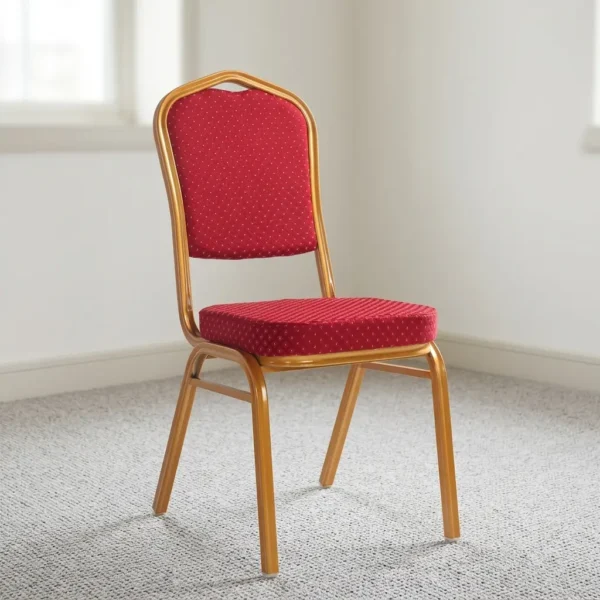 Stackable red conference chair featuring a crown-back gold-finished metal frame, padded seat and backrest upholstered in red patterned fabric with gold dot detailing, and four fixed legs with protective floor glides.
