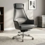 High back executive boss office chair featuring slate grey leather upholstery with an integrated padded headrest, contoured high-back shell with padded flared armrests, pneumatic tilt and height control mechanism, and a polished chrome five-star swivel base on dual-wheel casters.