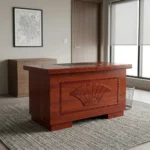 120cm office table with drawers featuring a rich mahogany/cherry wood veneer finish, a central black desk pad inset on the desktop, and a decorative front modesty panel with a carved fan shell motif and textured border molding.