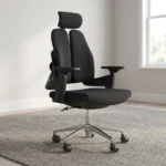 Dual back orthopedic office chair featuring an ergonomic split twin-backrest design in black upholstery, an adjustable curved headrest, padded black fabric seat cushion, adjustable T-shaped armrests, pneumatic tilt and height adjustment mechanism, and a polished aluminum five-star swivel base on dual-wheel casters.