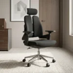 Dual back orthopedic office chair featuring an ergonomic split twin-backrest design in black upholstery, an adjustable curved headrest, padded black fabric seat cushion, adjustable T-shaped armrests, pneumatic tilt and height adjustment mechanism, and a polished aluminum five-star swivel base on dual-wheel casters.