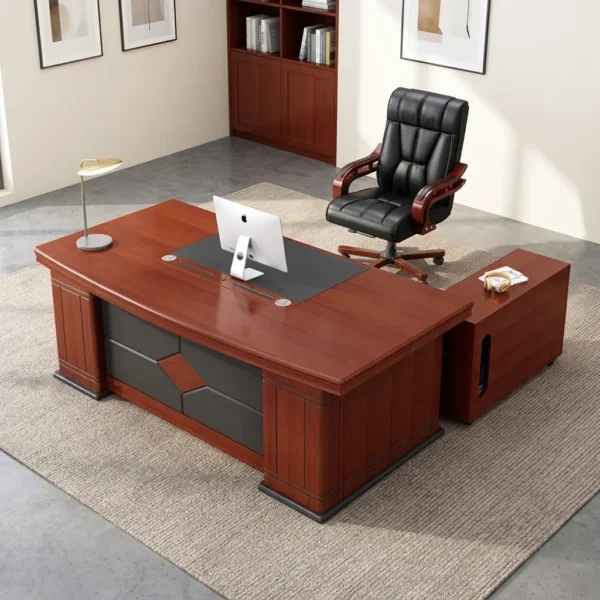 Executive 2m office table featuring a rich mahogany wood grain finish, an inset black leatherette writing pad with integrated wire management grommets, a patterned front modesty panel with leatherette accent panels, sturdy pedestal end legs on dark bases, and an attached side return cabinet.
