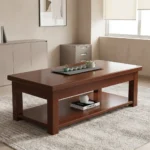 1200mm rectangular coffee table featuring a polished warm mahogany wood finish, a smooth rectangular top with thick aprons, a full-length lower open storage shelf, and sturdy square post legs.