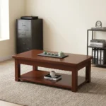 1200mm rectangular coffee table featuring a polished warm mahogany wood finish, a smooth rectangular top with thick aprons, a full-length lower open storage shelf, and sturdy square post legs.