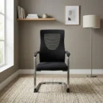 Black Visitor Chair with Armrest Welcome guests in comfort with this Black Visitor Chair with Armrest, designed to provide ergonomic seating, modern style, and dependable durability. It is ideal for executive offices, reception areas, meeting rooms, boardrooms, clinics, schools, banks, and corporate workplaces. Its sleek black finish and supportive armrests create a professional appearance while ensuring visitors remain comfortable during meetings, interviews, and waiting periods. Built from premium-quality materials with a reinforced steel frame, this black visitor chair with armrest is designed for everyday commercial use. As a result, it delivers reliable performance and excellent long-term value for offices and professional environments. Comfortable Visitor Seating The ergonomically designed backrest supports the back and shoulders, helping visitors maintain proper posture throughout meetings or appointments. Consequently, users enjoy lasting comfort during extended sitting. Additionally, the padded seat and supportive armrests reduce pressure on the body, creating a more relaxed seating experience. Its ergonomic design enhances visitor comfort and improves the overall office environment. Strong and Durable Construction Built with a reinforced heavy-duty frame, this visitor office chair provides dependable stability during regular daily use. The durable upholstery resists everyday wear while maintaining its neat and professional appearance. Furthermore, the sturdy construction ensures reliable performance in busy commercial settings. Easy Maintenance The smooth upholstery surface is easy to wipe clean, making routine maintenance quick and convenient. Therefore, the chair remains hygienic and attractive even in high-traffic reception and meeting areas. The quality materials help preserve its elegant appearance over time. Modern Professional Style The contemporary black finish complements executive desks, reception counters, conference tables, office workstations, and modern office furniture. As a result, it creates a coordinated and welcoming workspace suitable for commercial and professional environments. Key Features Premium black visitor chair with armrest Ergonomic back support Comfortable padded seat Supportive fixed armrests Reinforced heavy-duty frame Durable upholstery Easy-to-clean surface Suitable for commercial use Benefits Provides comfortable visitor seating Promotes proper sitting posture Enhances reception and meeting areas Supports frequent daily use Complements modern office interiors Easy to clean and maintain Offers dependable long-term durability Ideal for executive offices, reception areas, meeting rooms, boardrooms, clinics, schools, banks, and corporate workplaces.