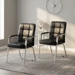 Modern black leather visitor chair featuring plush grid-tufted black leatherette upholstery, fixed armrests with black padded arm pads, and a sleek chrome cantilever sled frame.