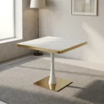 Modern square dining table featuring a white faux marble top with polished gold metallic edging, supported by a central white tulip pedestal column and a heavy flat square brass-toned base.